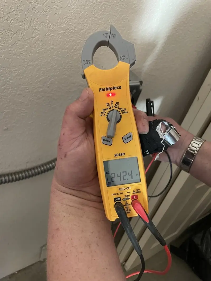 Voltage testing with clamp meter during Ceiling Fan Installation in Gastonia
